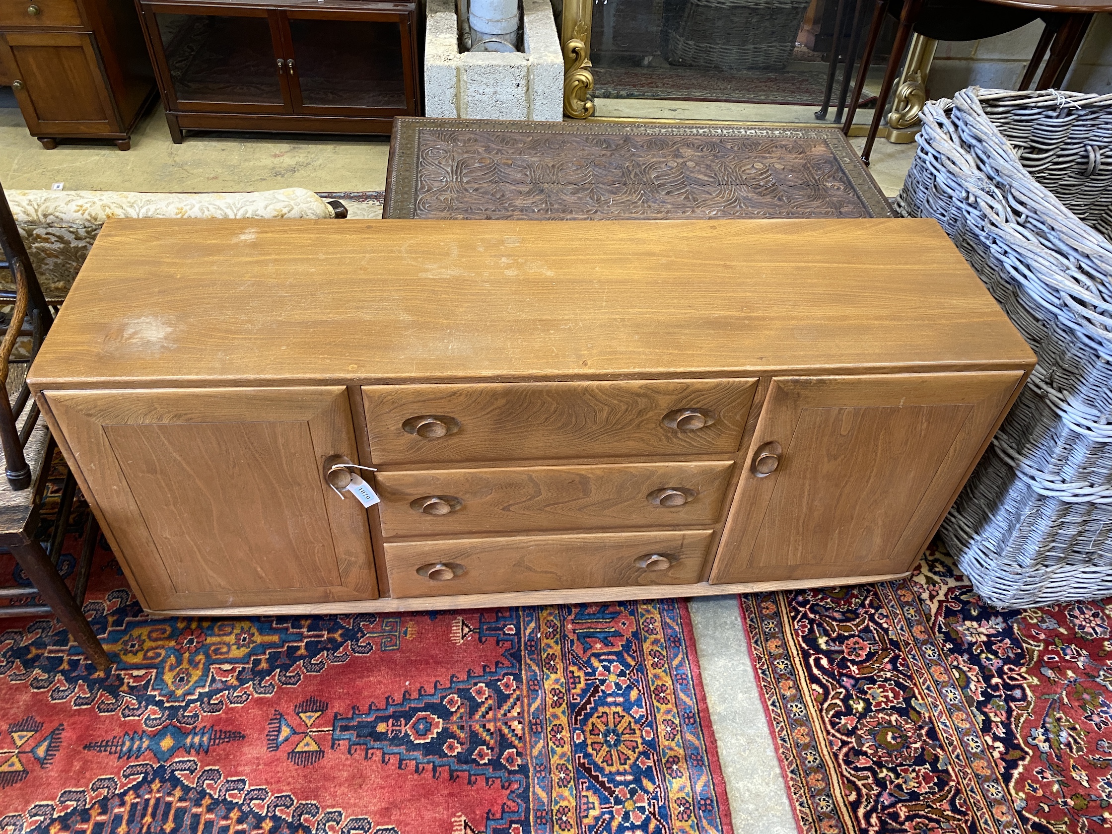 An Ercol light elm sideboard, length 155cm, depth 43cm, height 68cm